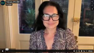 Screenshot of a Smiling Tess Filming an Online Webinar