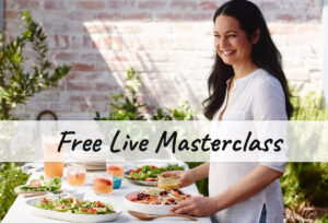 Tess Standing in front of a table making a yummy salad holding the dressing with the text "Free Live Masterclass"