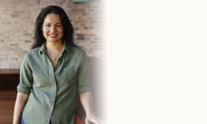 Tess Masters Smiling in Green Buttoned Shirt