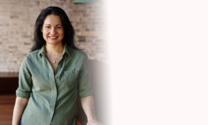 Tess Masters Smiling in Green Buttoned Shirt