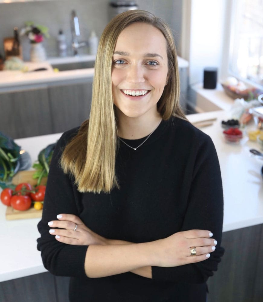 Meghan Donnelly smiling while standing in front of a kitchen