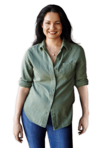 Tess Masters smiling in a casual green button down shirt and jeans