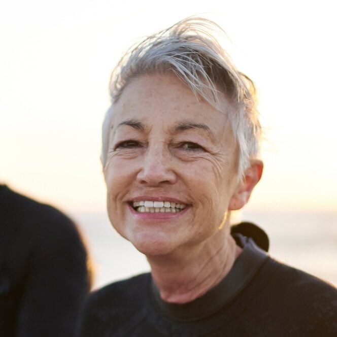 Cropped shot of a senior married couple coming from surfing